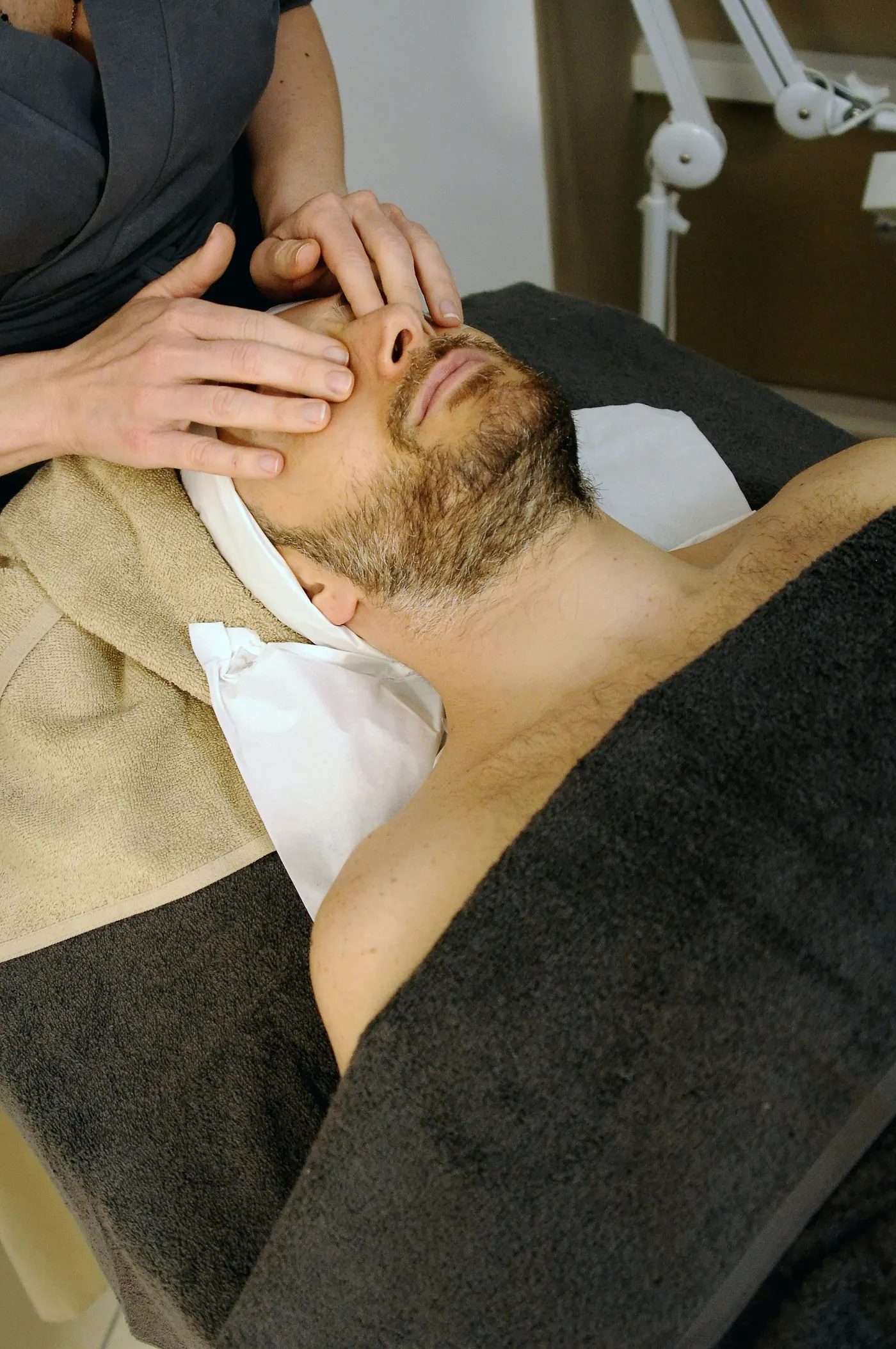 Professional massage therapist providing treatment